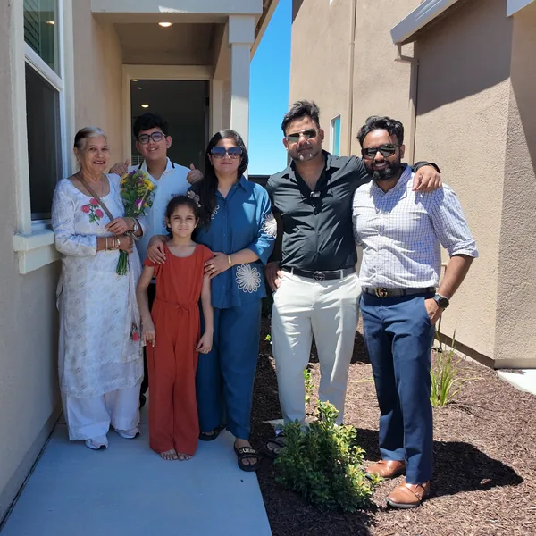 Multi-generational family celebrating their new home closing — The Saini Realty
